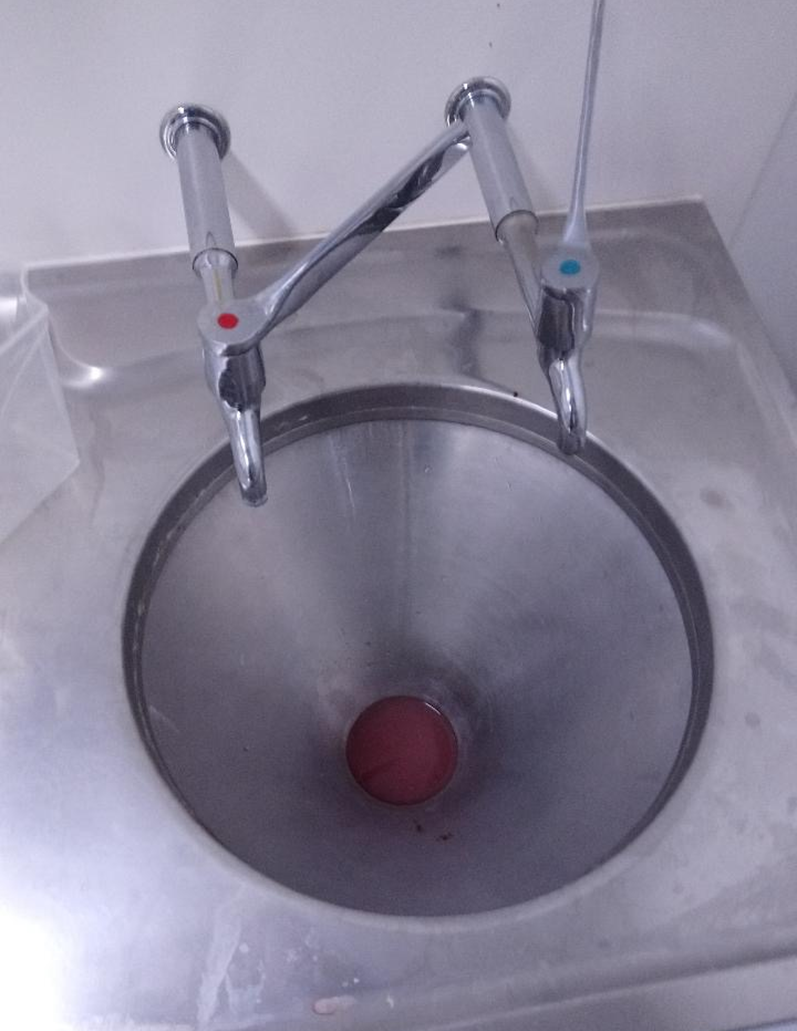 slop hopper with bodily fluids exposed to the air