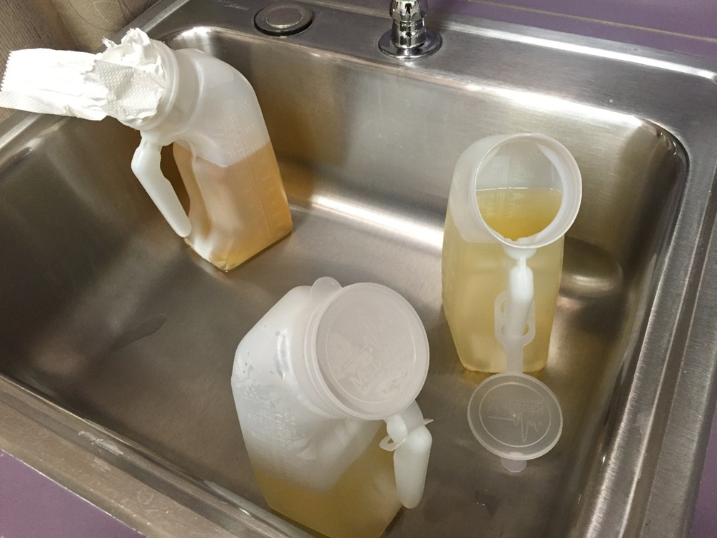 urine bottles left in the sink as the washer was still running a cycle